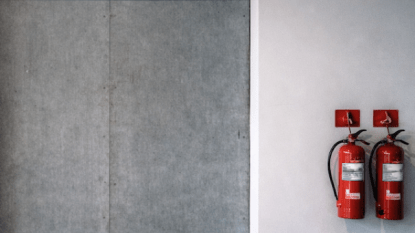 Emergency exit with fire extinguishers nearby